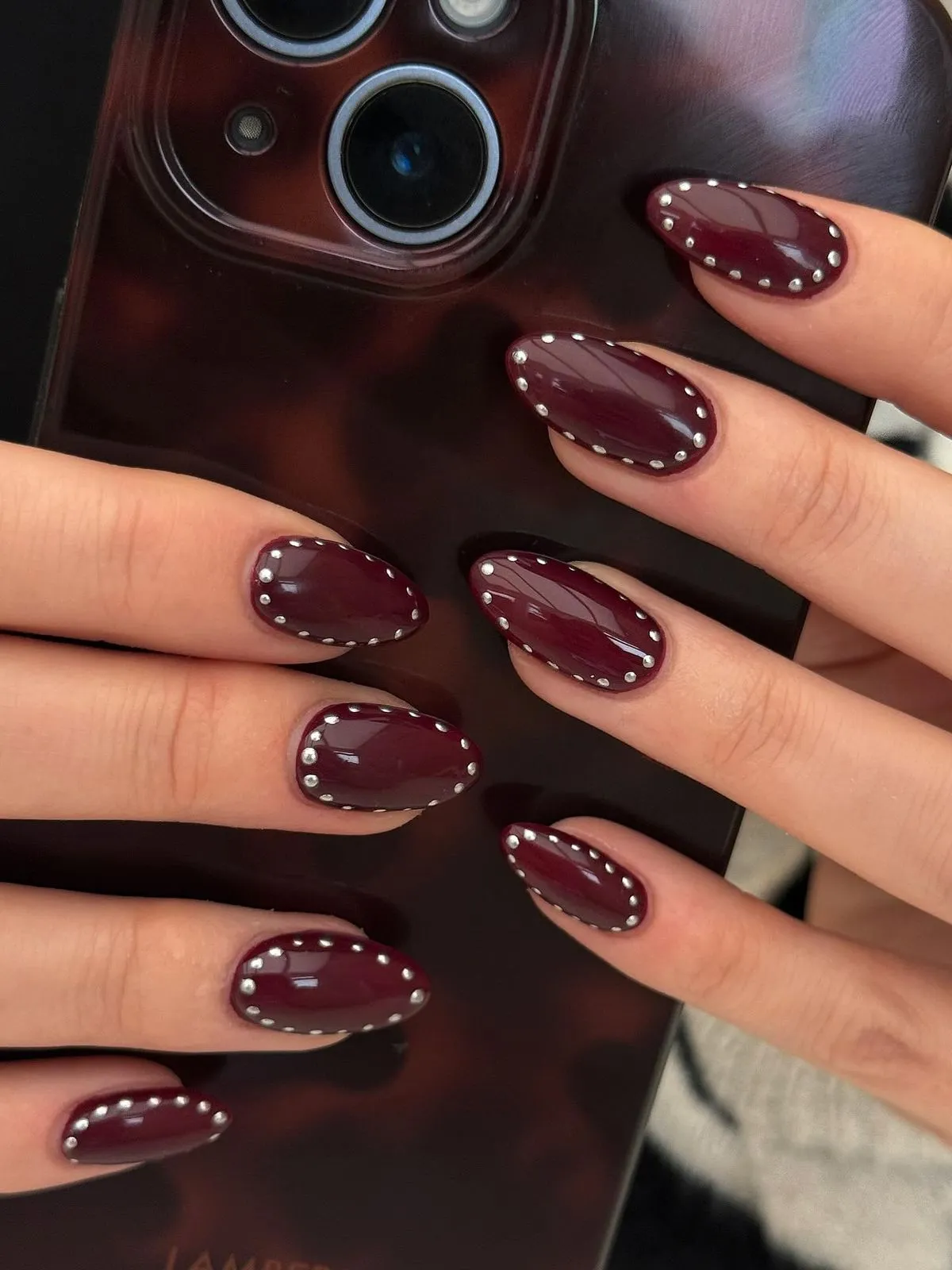Burgundy studded nails